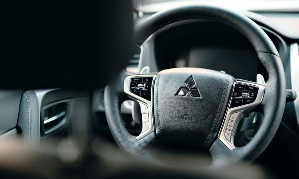 black honda steering wheel in close up photography